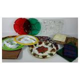 Group of plastic serving trays, placemats, table