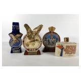 Four Eagles decanters, three of the four top