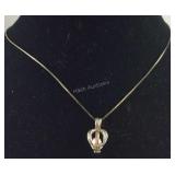 Sterling silver necklace with pink pearl caged