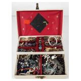Jewelry box full of jewelry, includes necklaces,