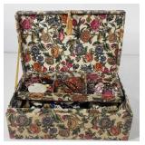Fabric floral jewelry box full of jewelry,