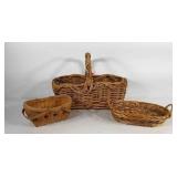 Group of baskets, one with apple design, all with