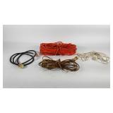 Four extension cords, largest is approximately