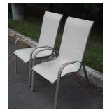 Pair of Outdoor Chairs one has wear damage on
