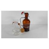 Wine carafe and two litter beer bottle with cap