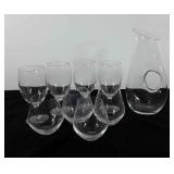 Wine carafe, four stemmed glasses and four no