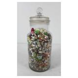 Glass jar full of jewelry, includes earrings,