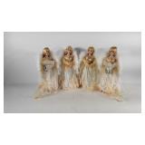 Four Christmas angel tree toppers with fiber