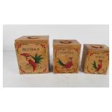 Three wooden canisters with painted rooster