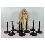 Porcelain doll with stands, includes nine stands