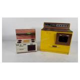 Two metal doll size stoves, some parts are
