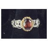 Size 6 Mozambique garnet.90ct solitaire stainless