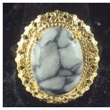 Size 11 Austrian pinolith 9.8ct solitaire 18k