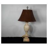 Decorative carved stone table lamp with vegan