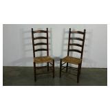 Two tall-back rush seat chairs, condition as
