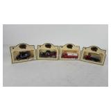 Four chevron commemorative model cars in boxes,