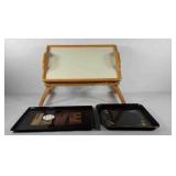 Three serving trays, one includes foldable legs,