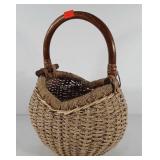 Woven basket with wooden handle