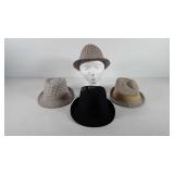 Styrofoam mannequin head and four fedoras, all