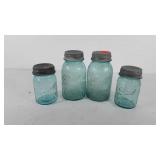 Four ball perfect Mason jars with zinc lids and