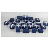24 jewelry boxes of various sizes, most with bows