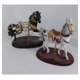 Two Lenox porcelain carousel horses on wooden