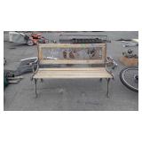 Park bench with deer scene back, rusted and
