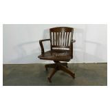 Wheeled wooden office chair, age wear as shown