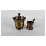 Two brass pestle and mortars, includes First