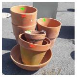 7 Terracotta flower pots of various sizes