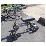 Seated scooter with custom pink camouflage tape,