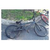 Black bike, chain off, tires flat, 20 inch wheels
