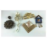 Five brooches, one is Hino