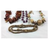 Four beaded costume necklaces