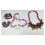 Two costume necklaces and two brooches