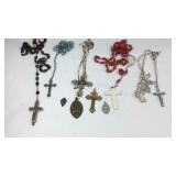 Five cross necklaces and four cross pendants