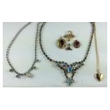 Two glitzy necklaces, four pendants one is a