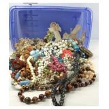 Plastic container with costume jewelry