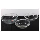 Three glass mixing bowls, 2 marked Pyrex 
Seller