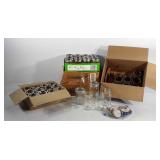 Mason jars, mostly half pint sized, with lids