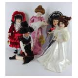 Group of five porcelain collector dolls, some