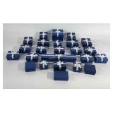 24 jewelry boxes of various sizes, most with bows