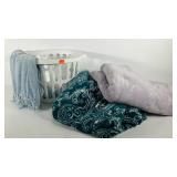 Laundry basket and three throw blankets