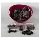 Storage bin full of curtain rings, finials, and