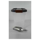 Food storage container with scoop