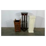 Two plant stands and one umbrella stand with