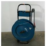 Delta strapping dispenser, includes crimper, roll