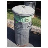 3 old galvanized trash cans with one lid