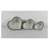 Three heart shaped ceramic nesting bowls with