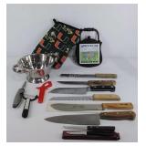 Group of kitchen items, knives, trivet, colander,